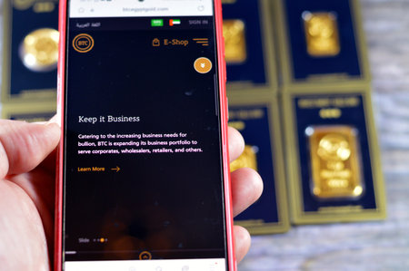 Cairo, Egypt, December 8 2023: BTC Bullion Trading Center for gold trade E Shop website with...