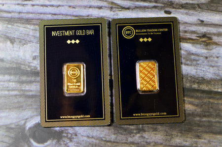 Cairo, Egypt, December 8 2023: 24K karat BTC Bullion Trading Center pure yellow gold 5 grams bar, gold investment, exchange price rate, inflation crisis and saving money assets conceptのeditorial素材