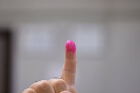 Election ink, indelible phosphoric ink or electoral stain, a semi-permanent ink or dye that is applied to the forefinger of voters during elections to prevent electoral fraud such as double votingの写真素材
