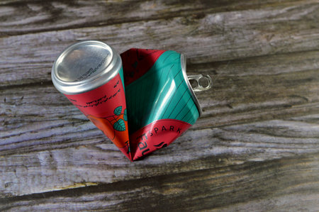 Cairo, Egypt, December 13 2023: Crushed dented Fayrouz Apple malt drink can, natural, refreshing...