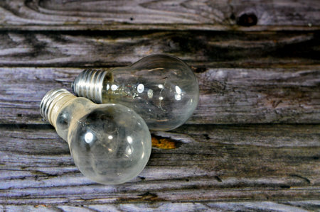 incandescent light globe bulb lamp, an electric light with a wire filament tungsten that is heated until it glows, consists of gas bulb, low pressure inert gas, Tungsten filament, wires, stem, capの写真素材