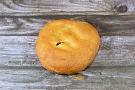 soft and chewy Date Filled Ajwa Agwa bun, golden-brown glaze dessert baked and stuffed with dates fruit and baked in the oven, a popular traditional pastry and bakery as a snack with tea in Egyptの写真素材