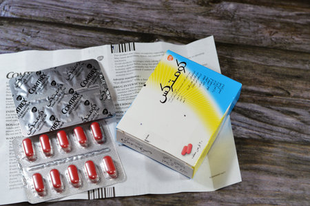 Cairo, Egypt, December 15 2023: Comtrex film coated capelts, acetaminophen, pseudoephedrine HCL, brompheniramine maleate, nasal decongestant, antihistamine, pain reliever, fever reducer by GSKのeditorial素材