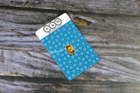 Cairo, Egypt, January 2 2024: SAM precious metal 24K karat pure yellow gold 1 gram bar, gold investment, exchange price rate, inflation crisis and saving money assets concept, buying gold barsのeditorial素材