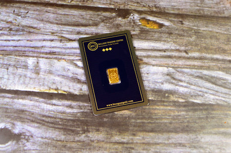 Cairo, Egypt, January 2 2024: 24K karat BTC Bullion Trading Center pure yellow gold 1 gram bar, gold investment, exchange price rate, inflation crisis and saving money assets concept, buying goldのeditorial素材