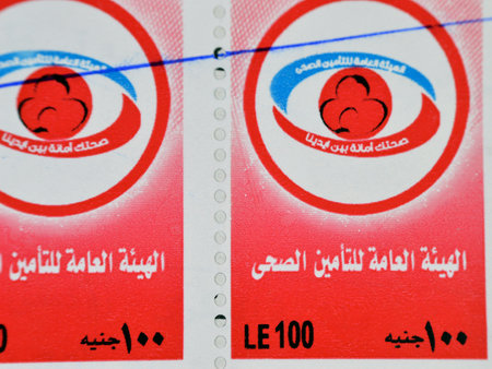Cairo, Egypt, January 10 2024: Egyptian service stamp for health services, Translation (The General Authority for Health Insurance, We care for your health), an Egyptian Government health agencyのeditorial素材