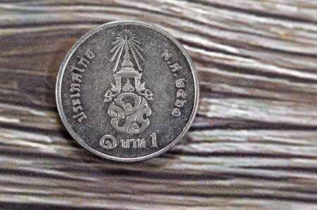 Reverse side of 1 one Baht Thai coin features Crowned monogram, 1 Baht - Rama X 1st portrait, 1 THB years 2561-2566 (2018-2023), obverse side features Bust facing left of Maha Vajiralongkorn Rama Xの写真素材