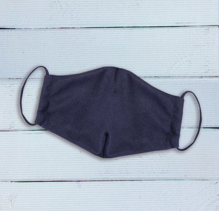 Black Mask  virus-On White wood Desk.の写真素材