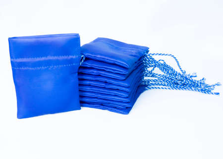 blue small Drawstring bag canvas with nice laces. On white background.の写真素材