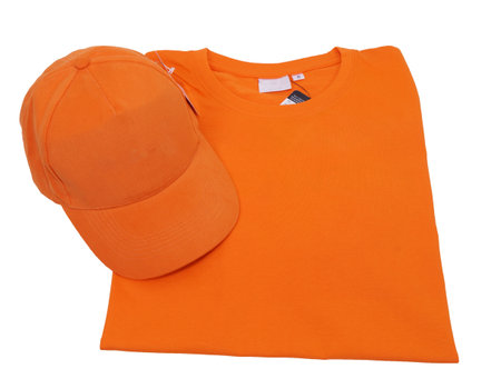 Orange cap and T-shirt top view isolated on white background.の写真素材