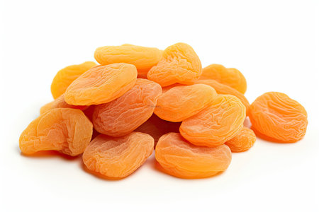 Heap of dried apricots isolated on white background. Healthy food.の素材