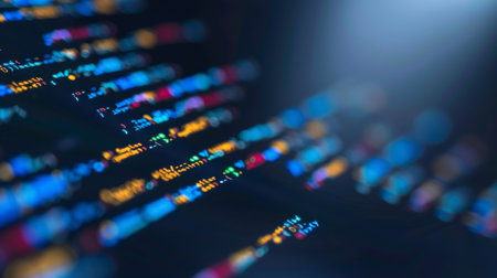 Abstract programming code on a black background. The concept of programming and coding.の素材