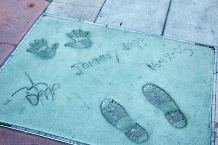 Hollywood, CA - January 19: Johnny Depp's hand and foot prints in the sidewalk infront of Graumans Chinese Theater in Hollywood, California 2011.のeditorial素材