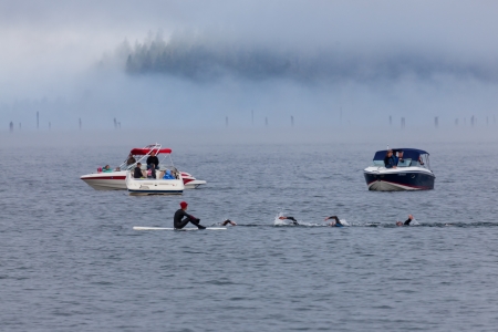 COEUR D ALENE, ID - JUNE 23:   Professional division swimmers starting their second swim lap at the June 23, 2013 Ironman Triathlon in Coeur d'Alene, Idaho.のeditorial素材