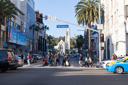 HOLLYWOOD, CALIFORNIA - February 8 2015: People crossing the street at an entersection on Hollywood Blvd  on February 8, 2015 in Hollywood, CA.のeditorial素材