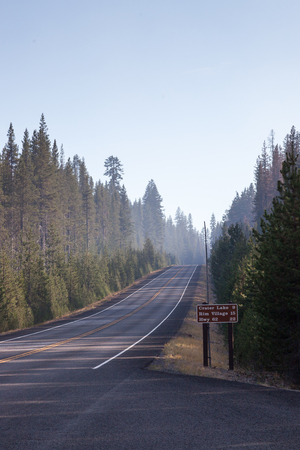 The north entrance going into Crater Lake with smoke from a forest fire causing a hazardous condition.の写真素材