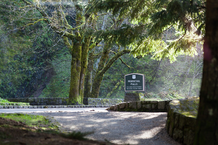 COLUMBIA RIVER GORGE - April 9 2014: A wooden sign identifying Horsetail Falls in the Columbia River Gorge National Scenic Area located in Oregon.のeditorial素材