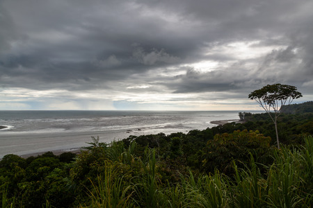 A cloudy and dark afternoon in the southern Pacific coast of Costa Rica with a beautiful coastal...
