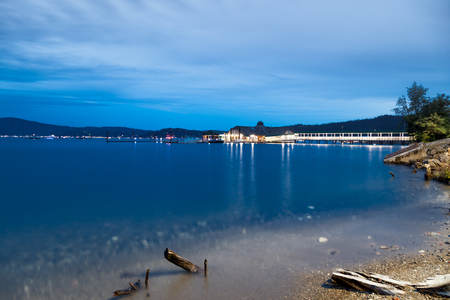 COEUR D'ALENE, IDAHO, USA - JULY 4, 2018: The Cedars floating restaurant on Lake Coeur d'Alene at twilight on the Fourth of July in Coeur d'Alene, Idaho.のeditorial素材