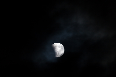 WOODBURN, OREGON - April 14, 2014:  The blood moon at the very beginning stages of a total lunar...