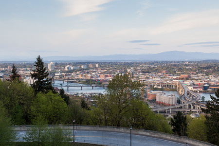 PORTLAND, OREGON - April 14, 2014:  The view from Marquam Hill Upper Tram Station of city buildings and Marquam Bridge over the Willamette River in Portland, OR on April 14, 2014. Twilight slow shutter.の写真素材