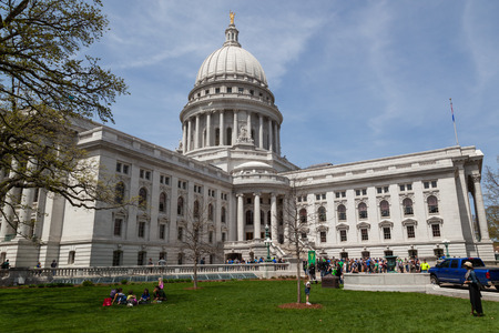 MADISON, WISCONSIN - May 10, 2014:  A group of people rally in front of the southeastern entrance to the capital building in Madison, WI on May 10, 2014.のeditorial素材