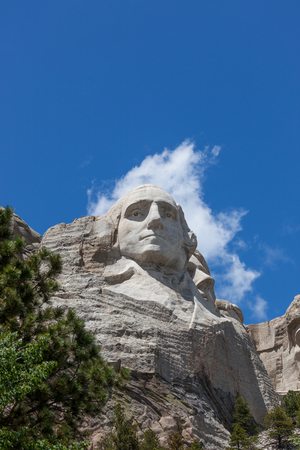 Looking up at a carved likeness of George Washington, one of four United States Presidents carved into granite at Mount Rushmore National Memorial in South Dakota.のeditorial素材