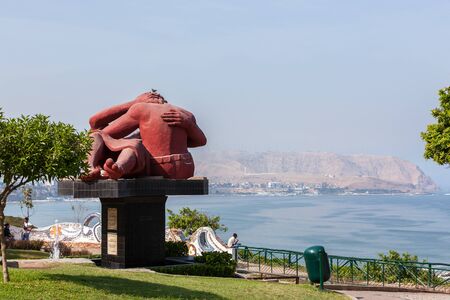 MIRAFLORES, LIMA, PERU - May 10, 2016: Beautiful mosaic walls and the statue The Kiss by Victor Delfin, in el parque del Amor (love park) with views of the ocean and City of Lima on May 10, 2016 .のeditorial素材
