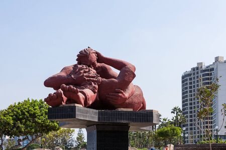 MIRAFLORES, LIMA, PERU - May 10, 2016: The statue The Kiss by Victor Delfin, in el parque del Amor (love park) with views of the City of Lima on May 10, 2016 .のeditorial素材