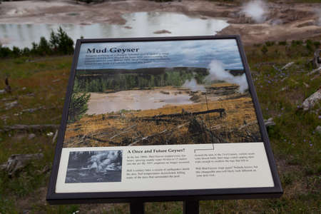 YELLOWSTONE NATIONAL PARK, USA - July 12 2014:  An informational sign giving details on the Mud Geyser located in Yellowstone National Park, Wyoming on July 12, 2014.のeditorial素材