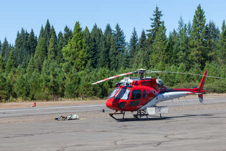 Prospect,  Oregon / USA - September 9, 2014:  A small rescue helicopter is on standby at the Prospect State Airport in support of the 790 Fire crew near Prospect, Oregon.のeditorial素材