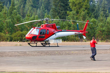 Prospect,  Oregon / USA - September 13, 2014:  A small rescue helicopter is on standby at the Prospect State Airport in support of the 790 Fire crew near Prospect, Oregon.のeditorial素材
