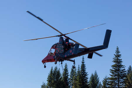 Prospect,  Oregon / USA - September 9, 2014:  The special built K-MAX helicopter with intermeshing rotors lifting off the runway to go fight the 790 Fire near Prospect, Oregon.のeditorial素材