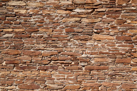 A section of a well build ancient rock wall from the Anasazi people lit by the afternoon sunshine at...
