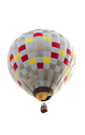 A checkered pattern hot air balloon floating against an isolated white background.の写真素材