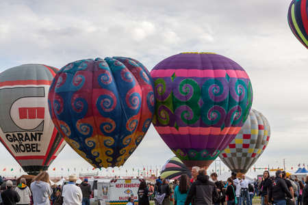 Albuquerque,  New Mexico / USA - October 8, 2014:  Several unique hot air balloons getting ready to fly above the large crowds at the Balloon Fiesta in Albuquerque, NM.のeditorial素材