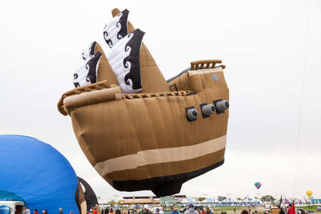 Albuquerque,  New Mexico / USA - October 8, 2014:  A ship shaped balloon prepares to take off among the large crowds at the Balloon Fiesta in Albuquerque, NM.のeditorial素材