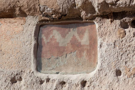 A piece of glass protects an original paint pattern of the Pueblo people on the canyon wall in Bandelier National Monument, New Mexico.の写真素材