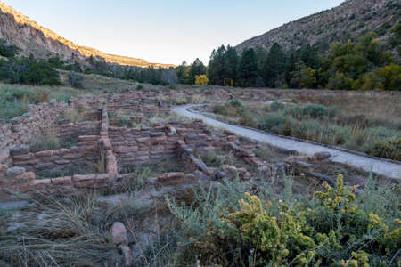 Rock, brick, and clay walls built in a grid pattern that have been eroded over many years in the Frijoles Canyon at Bandelier National Monument, New Mexico.の写真素材