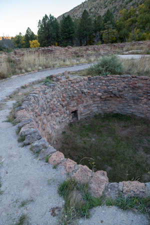 A round subterranean structure built by the Pueblo people called a Kiva is located in the valley floor of Frijoles Canyon in Bandelier National Monument, New Mexico.の写真素材