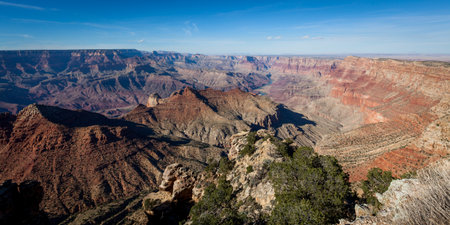 Looking from the Desert View Watchtower into the colorful landscape of the Grand Canyon and the Colorado River in Northern Arizona on a clear day.の写真素材