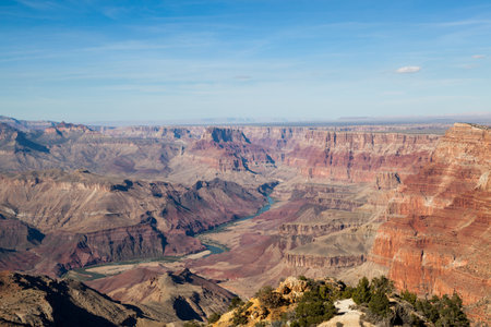Looking from the Desert View Watchtower into the colorful landscape of the Grand Canyon and the Colorado River in Northern Arizona on a clear day.の写真素材