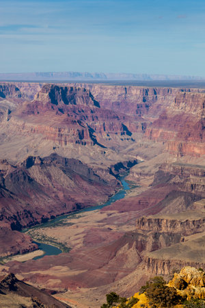 Looking from the Desert View Watchtower into the colorful landscape of the Grand Canyon and the Colorado River in Northern Arizona on a clear day.の写真素材