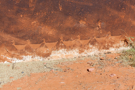 Ancient petroglyphs carved into the sandstone walls of Glen Canyon along the Colorado River near Page, Arizona.の写真素材