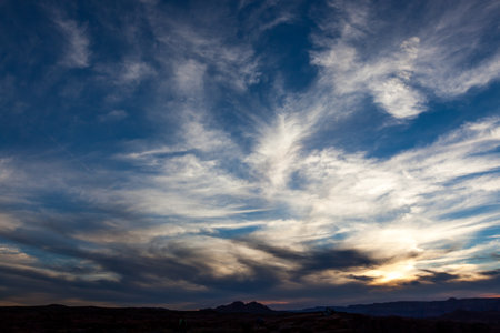The start of sunset in the sky over Horseshoe Bend in Arizona where a lot of tourists travel to see the famous feature of Glen Canyon and the Colorado River.の写真素材