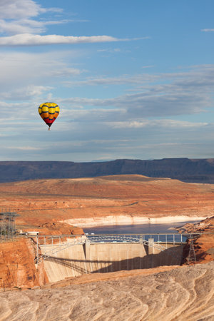 Page, Arizona / USA - October 31, 2014:  A participant of the Lake Powell Balloon Regatta floats above the Glen Canyon Dam in Page, Arizona.のeditorial素材