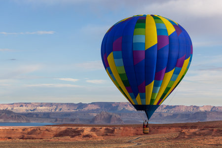 Page, Arizona / USA - October 31, 2014:  A participant in the Lake Powell Balloon Regatta floats over scenic landscape at the annual festival in Page, Arizona.のeditorial素材