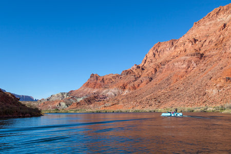 Glen Canyon, Arizona / USA - October 30, 2014:  A tour guide points down river while taking people on a tour of Glen Canyon and the Colorado River.のeditorial素材