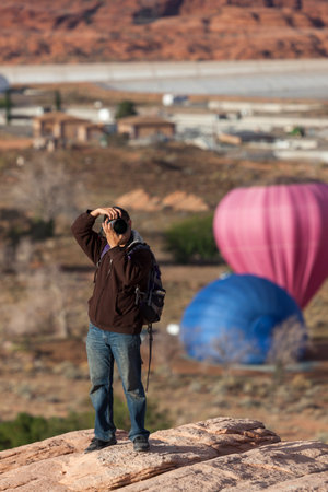 Page, Arizona / USA - October 31, 2014:  A photographer takes photos of festive balloons at the annual Lake Powell Balloon Regatta in Page, Arizona.のeditorial素材