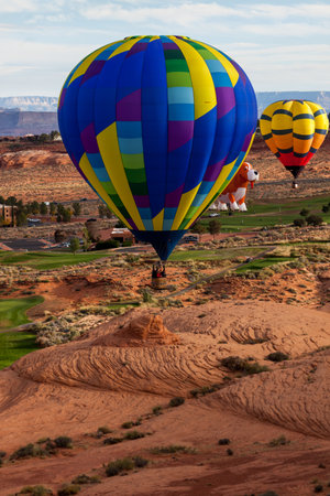 Page, Arizona / USA - October 31, 2014: Participants in the Lake Powell Balloon Regatta floats over the Lake Powell National Golf Course during the annual festival in Page, Arizona.のeditorial素材
